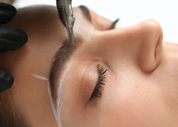extreme close up of professional eyebrow microblad